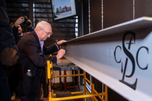 Our History Beam Signing STL Chess Club