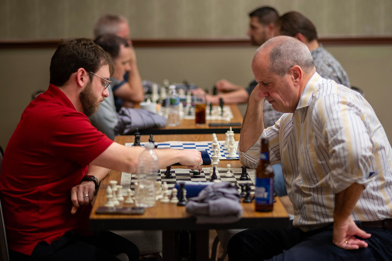 Adults playing chess