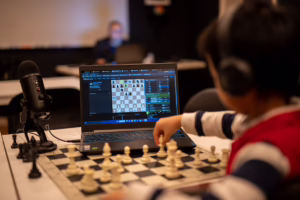 Student playing through a digital chess lesson