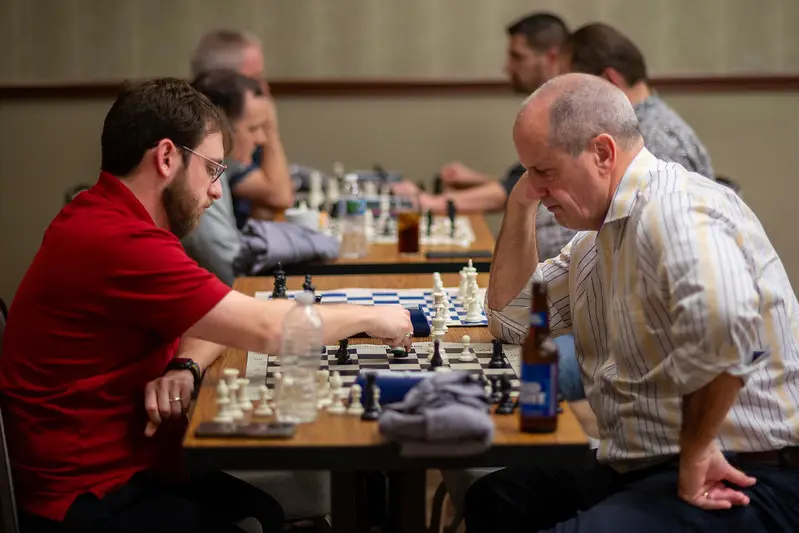 Adults playing chess